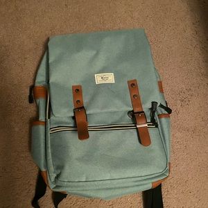 Back pack with padded insert for laptop and USB port to charge phone on the side